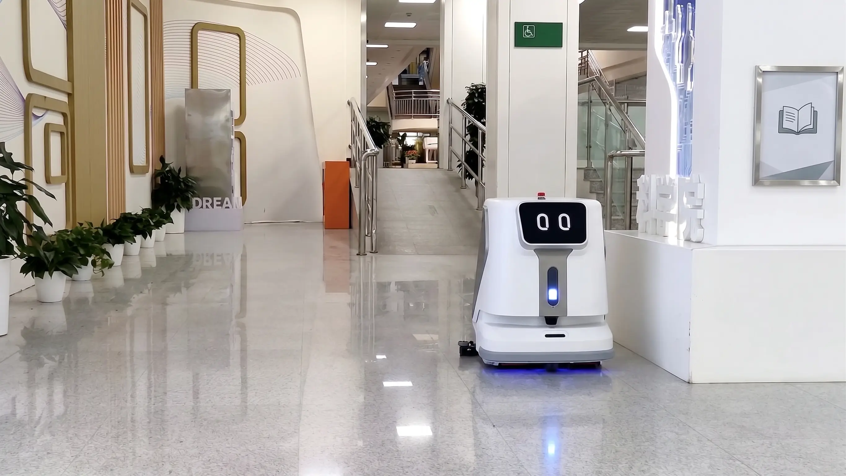 OpenDroids cleaning robot working a dining room aisle after close