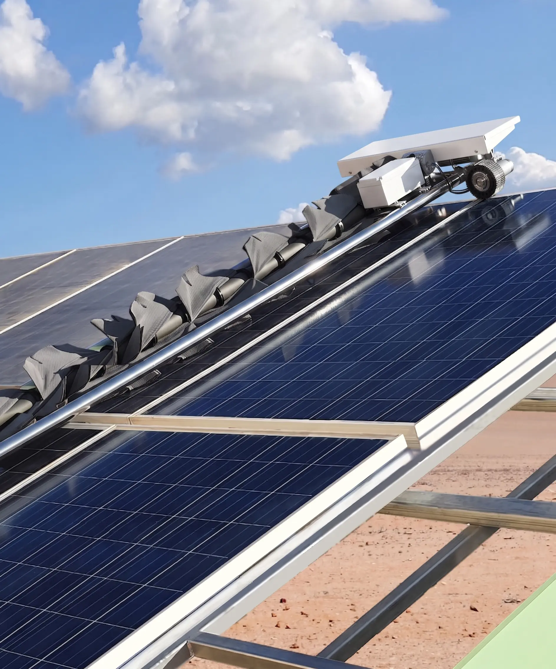 OpenDroids cleaning robot gliding along a row of ground-mount solar panels at dawn with panel rows extending toward the horizon